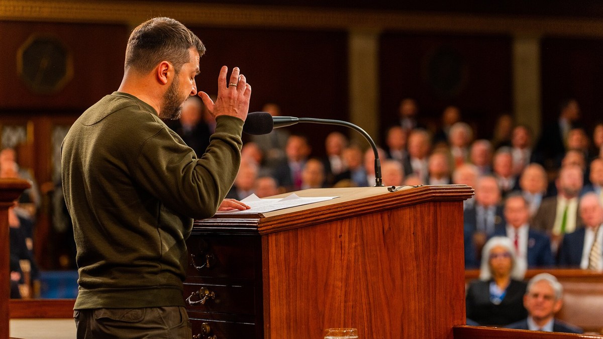 Ukrainian President Volodymyr Zelensky speaking at a lectern